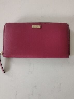 kate spade raspberry zip-around wallet with gold plaque